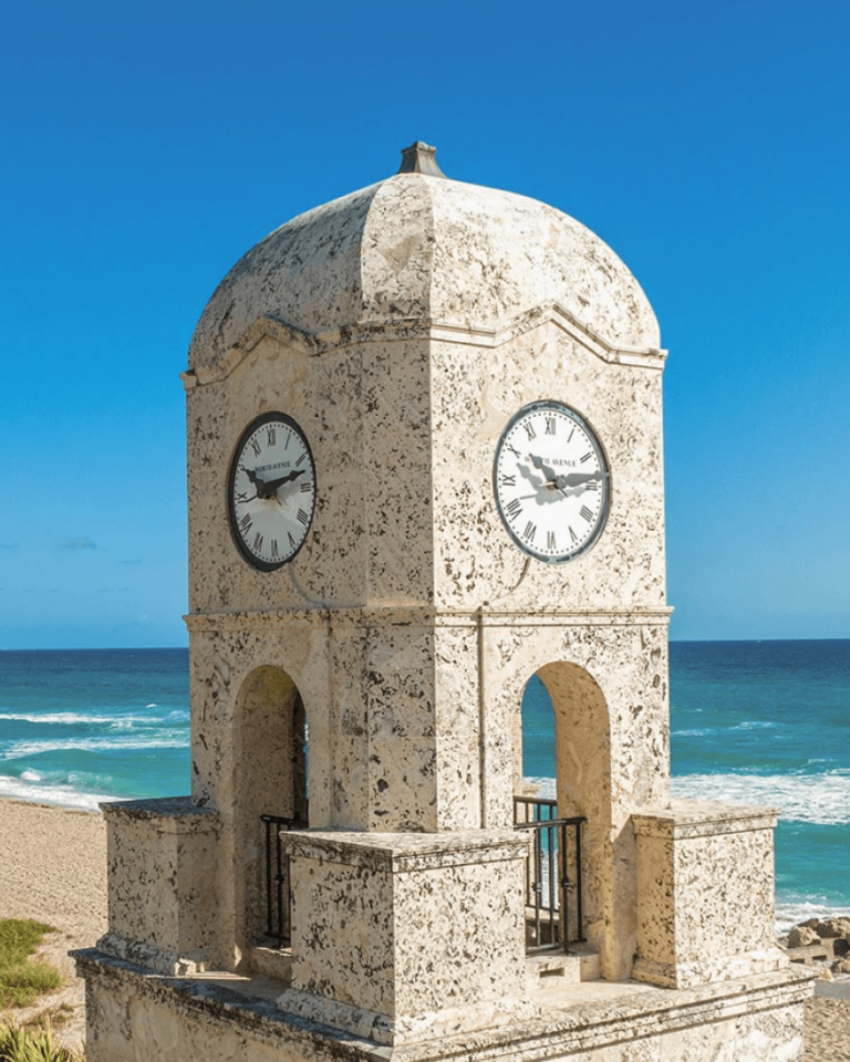 Palm Beach landmark featuring a clock by the beach